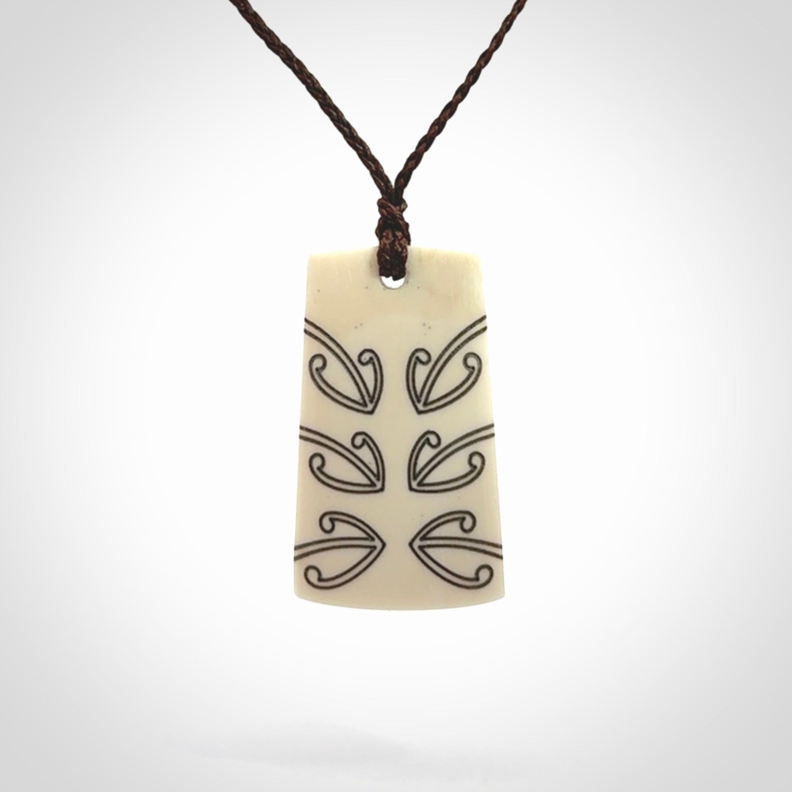 Hand carved bone toki pendant