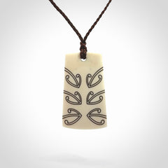 Hand carved bone toki pendant