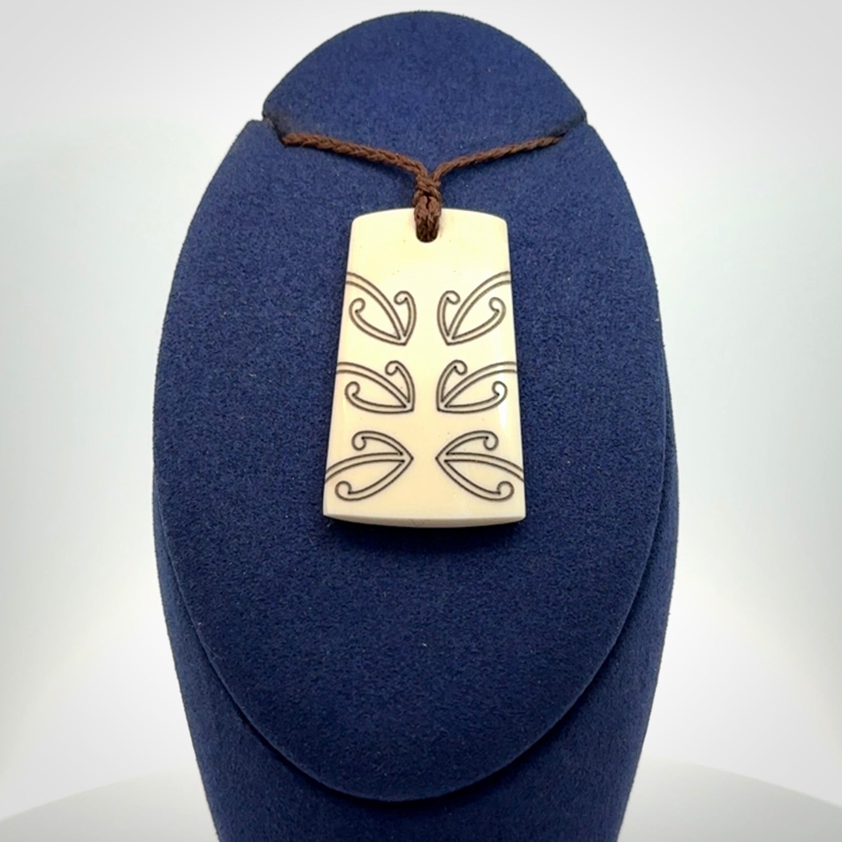 Hand carved bone toki pendant