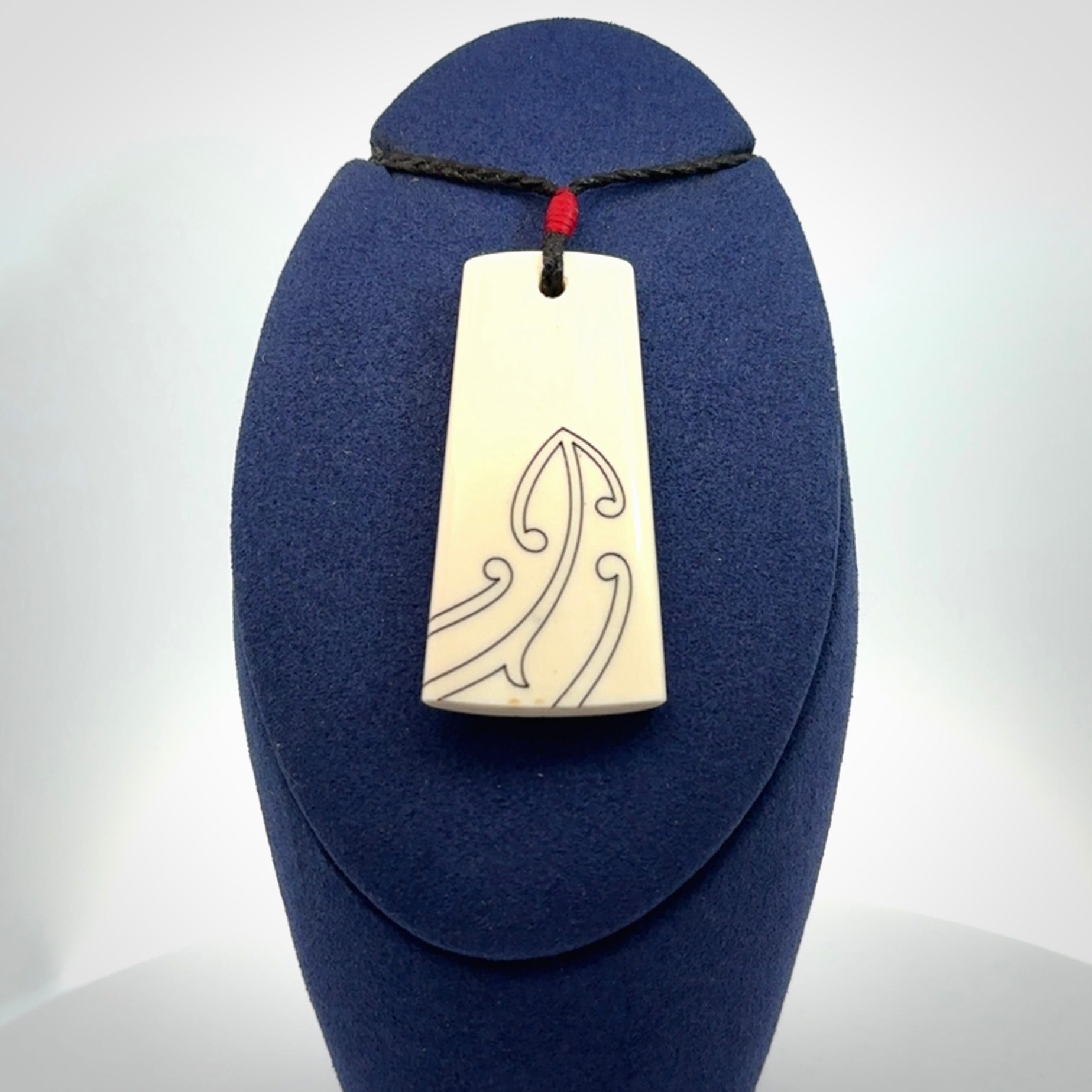Hand carved bone toki pendant