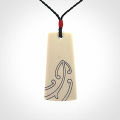 Hand carved bone toki pendant
