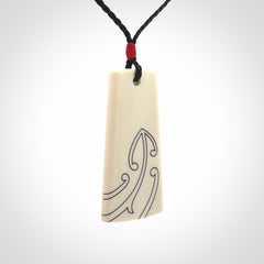 Hand carved bone toki pendant