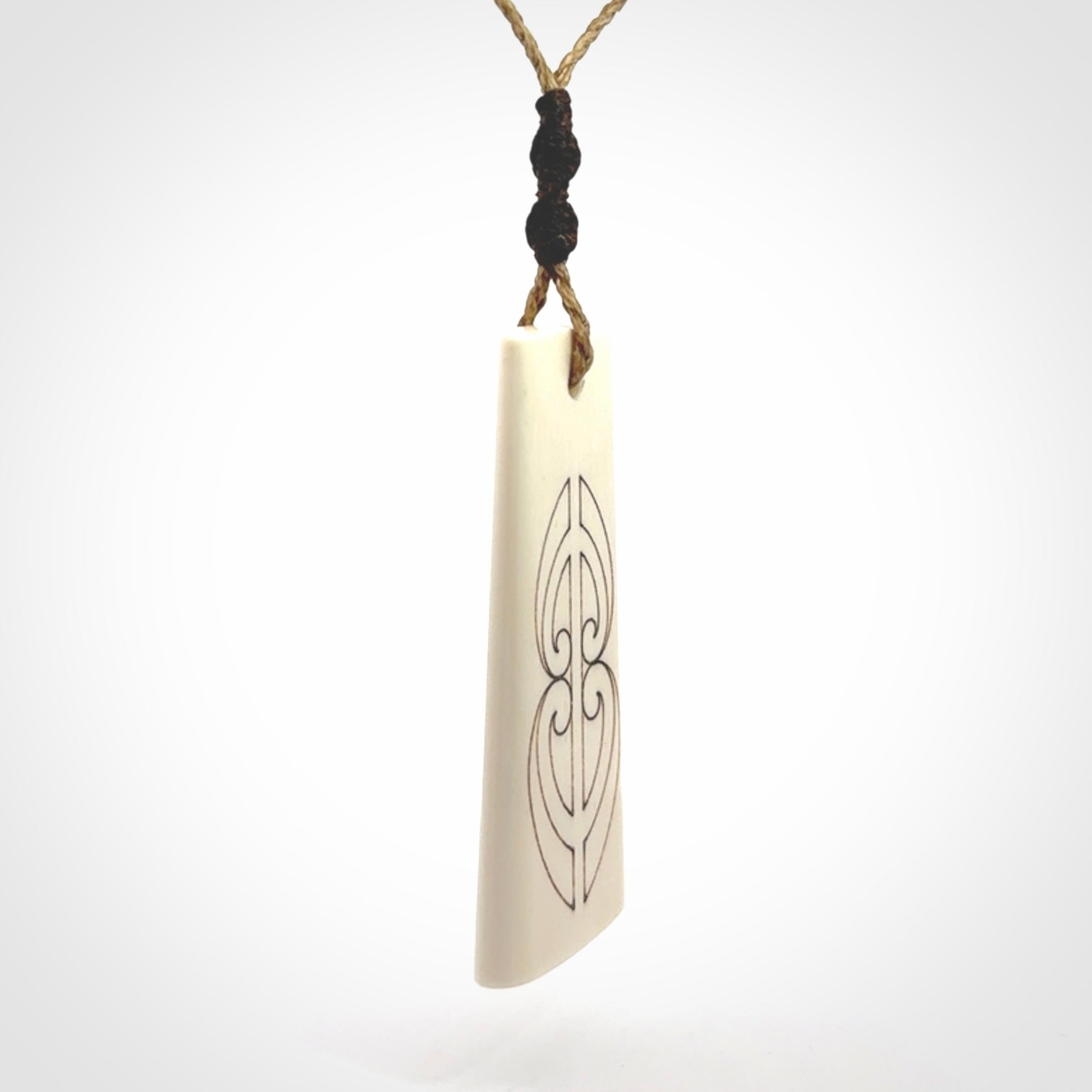 Hand carved bone toki pendant