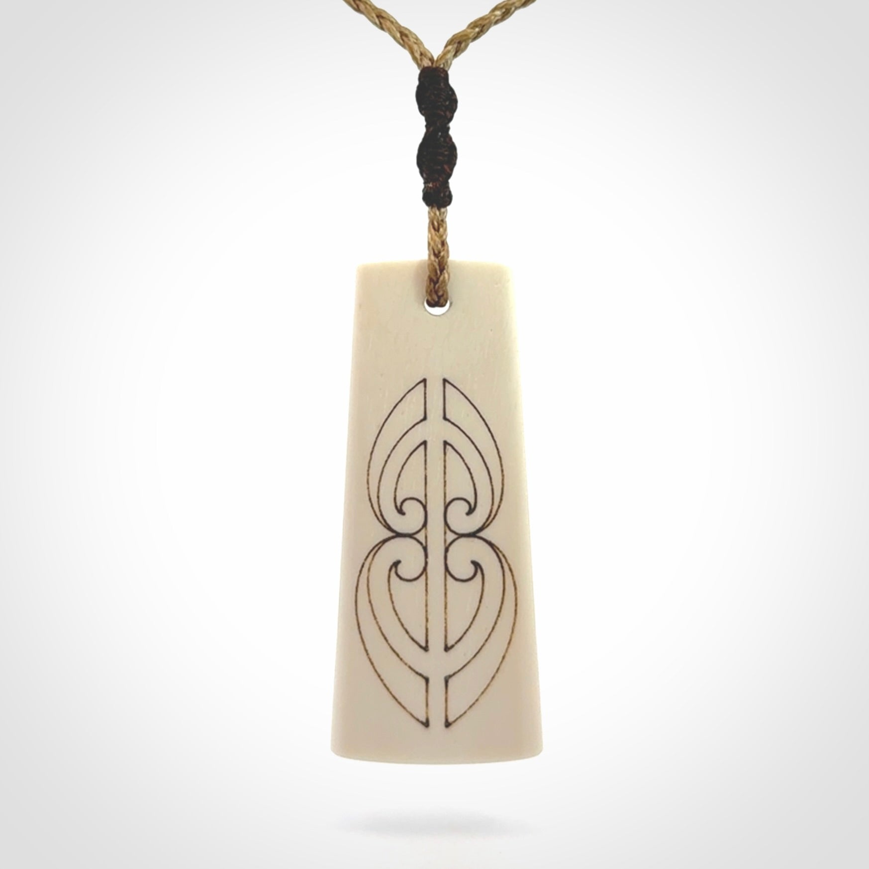 Hand carved bone toki pendant