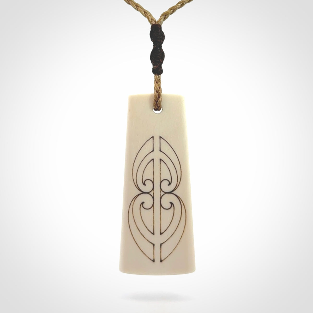 Hand carved bone toki pendant