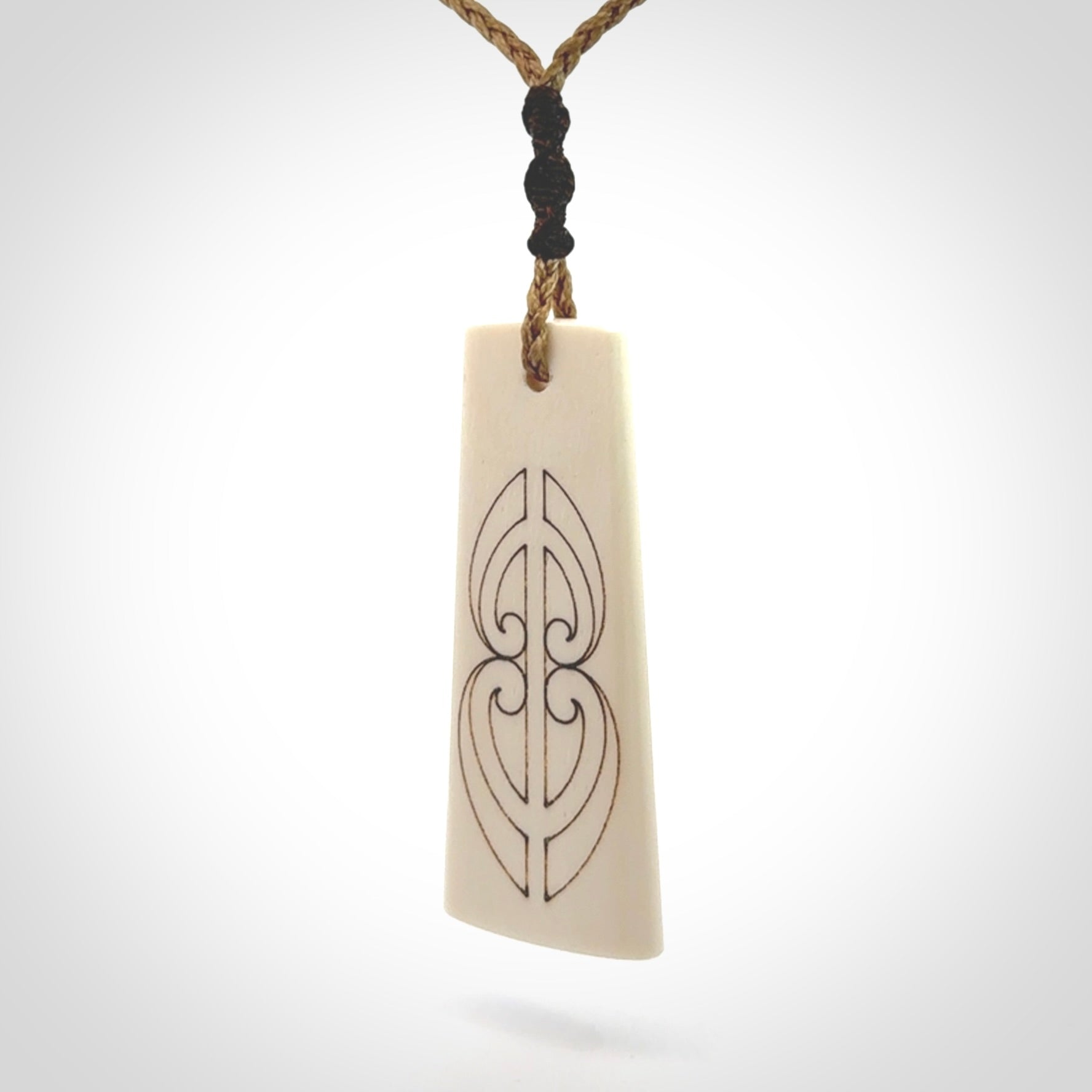Hand carved bone toki pendant