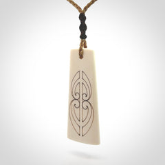 Hand carved bone toki pendant