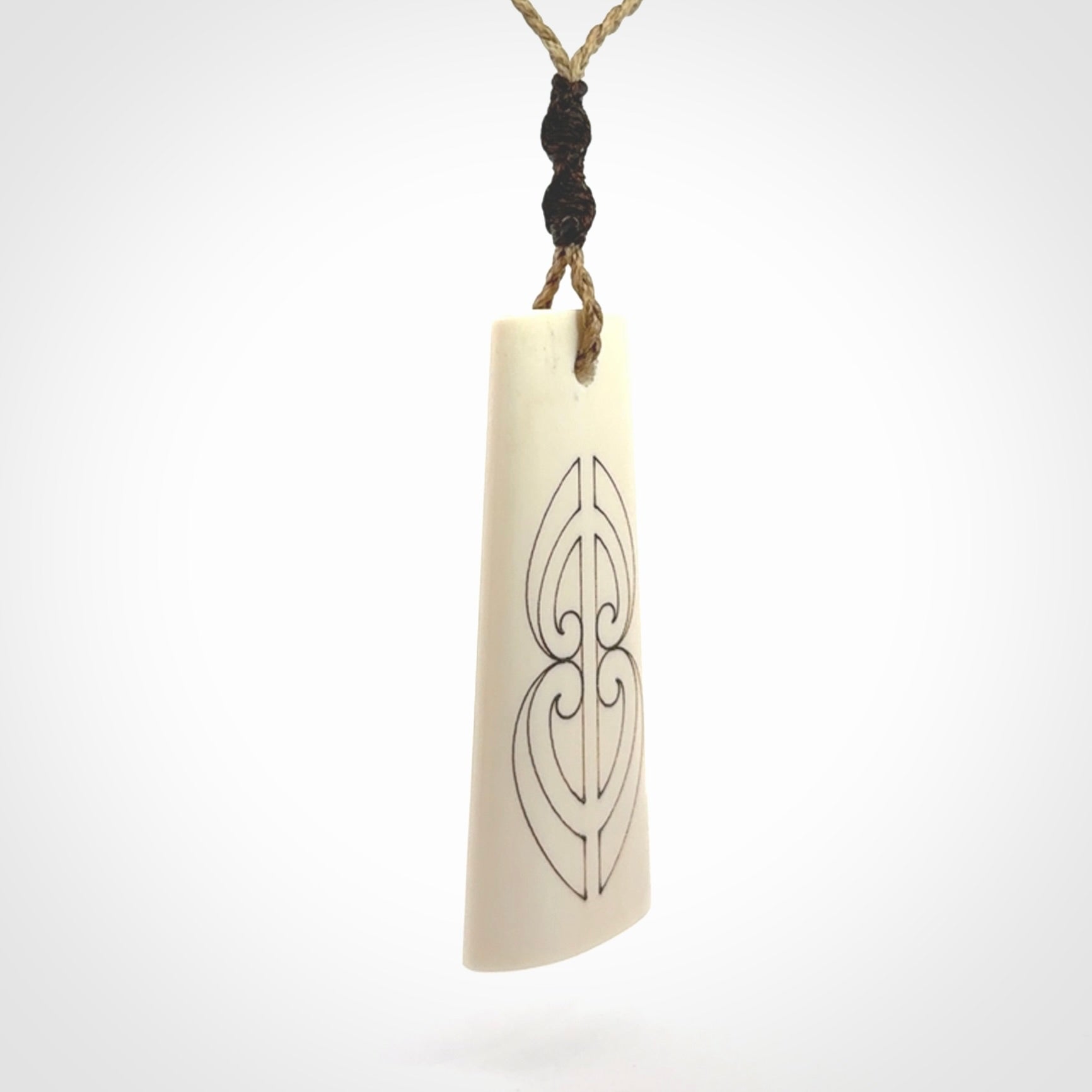 Hand carved bone toki pendant
