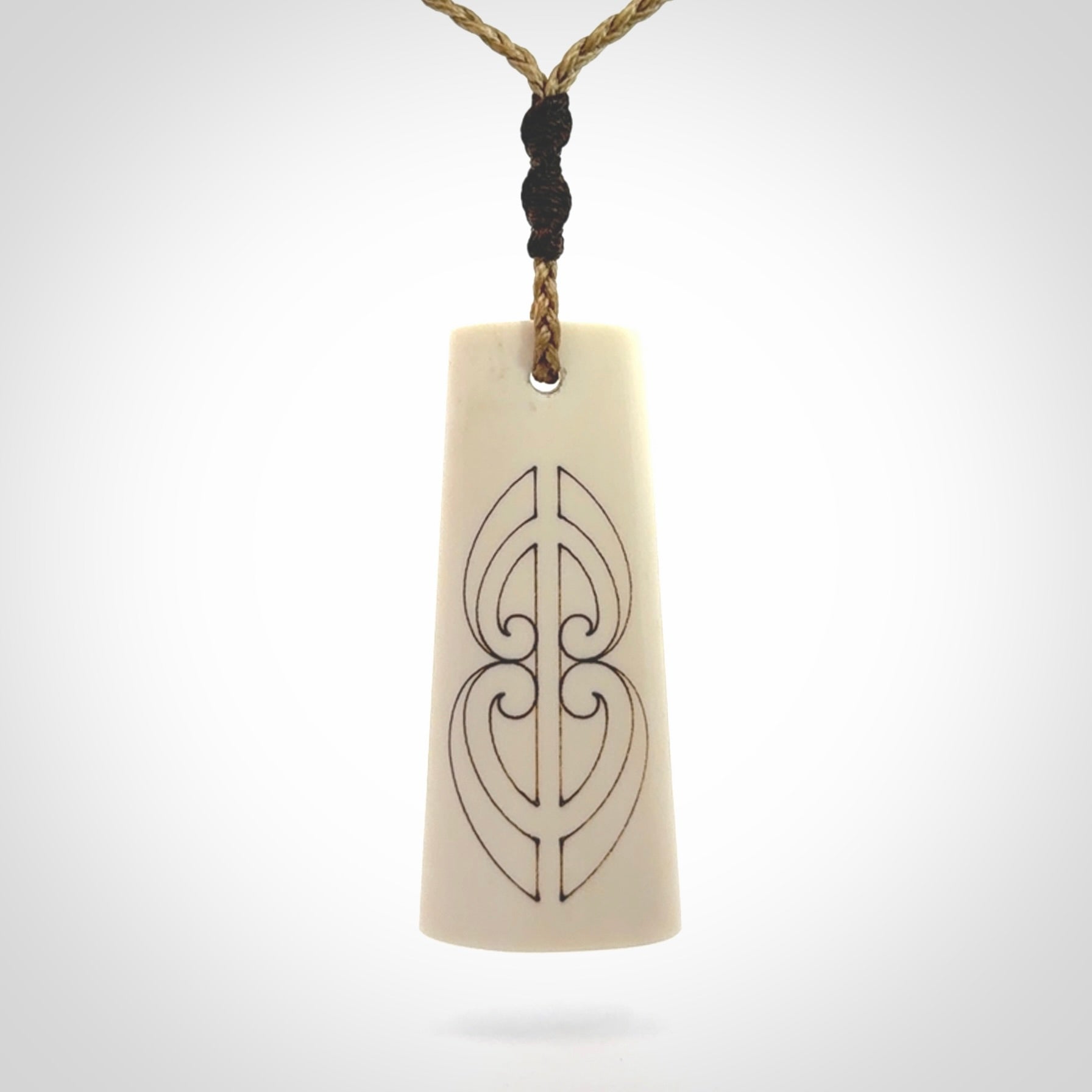 Hand carved bone toki pendant