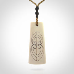Hand carved bone toki pendant