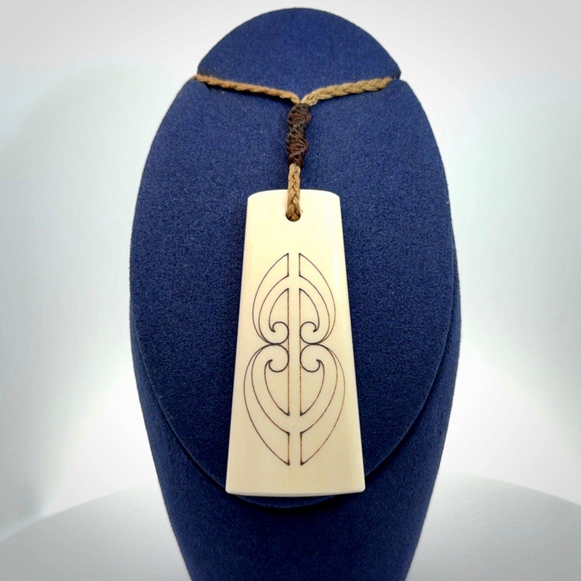 Hand carved bone toki pendant