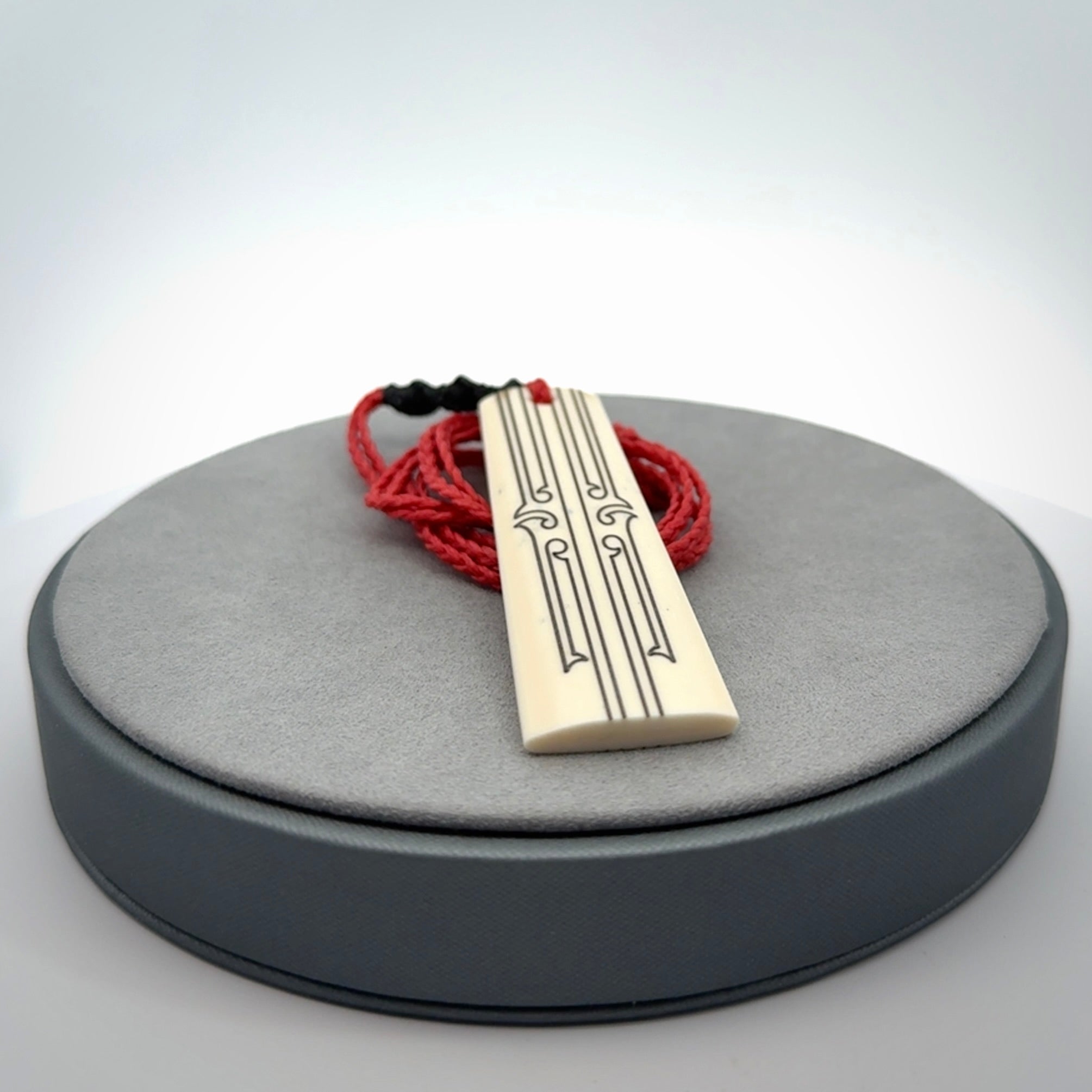 Hand carved bone toki pendant
