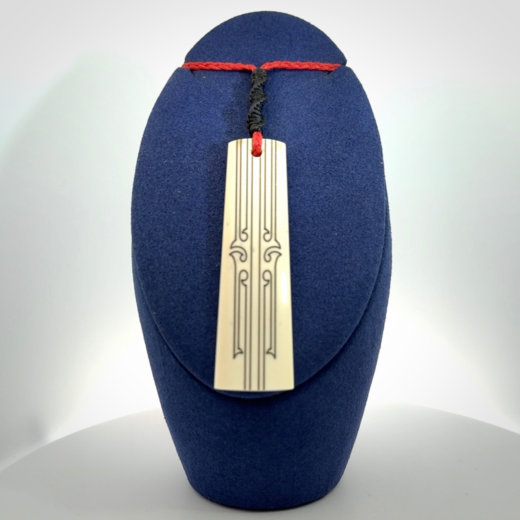 Hand carved bone toki pendant