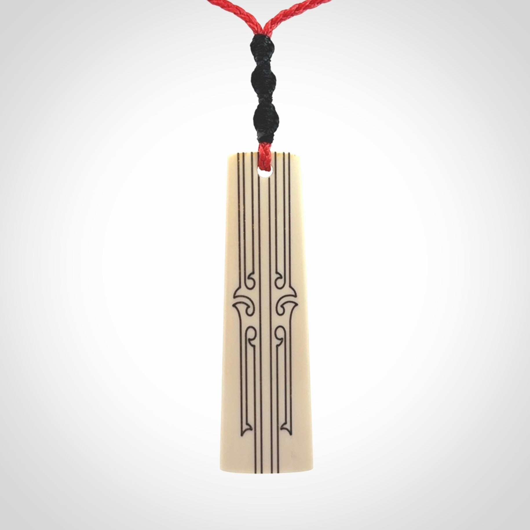 Hand carved bone toki pendant
