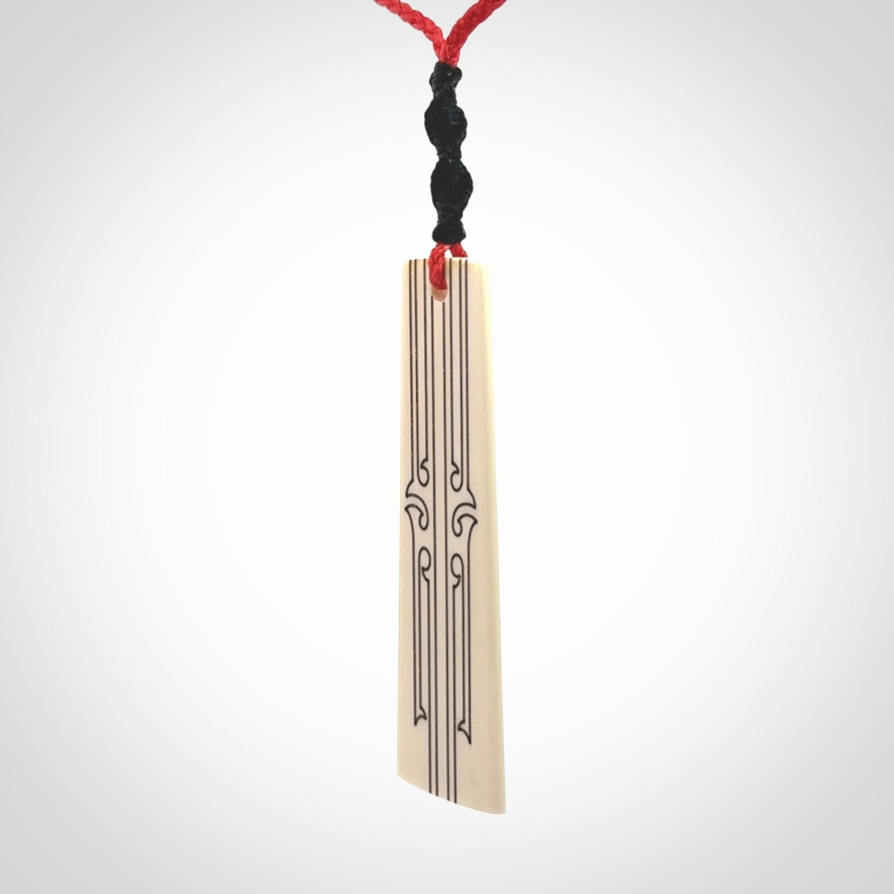 Hand carved bone toki pendant