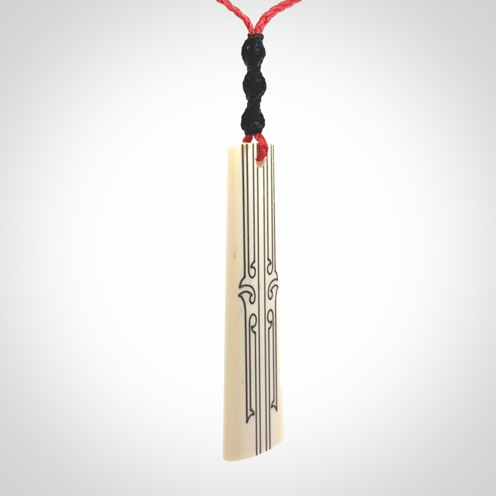 Hand carved bone toki pendant