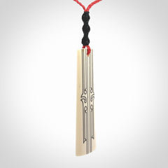 Hand carved bone toki pendant