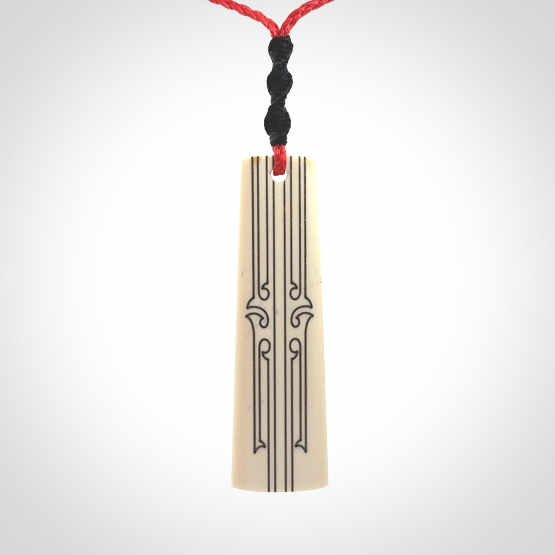 Hand carved bone toki pendant