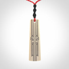 Hand carved bone toki pendant