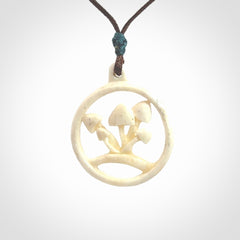 This is a hand carved bone mushroom pendant. This is a smaller sized necklace with adjustable cord.