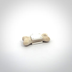 This is a hand carved deer antler dog bone dog tag. It is made from deer antler, bone and sterling silver. Hand made dog tags for your dog.