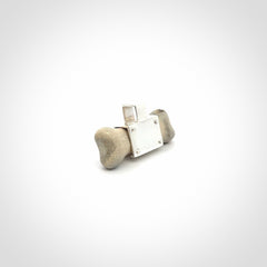 This is a hand carved deer antler dog bone dog tag. It is made from deer antler, bone and sterling silver. Hand made dog tags for your dog.