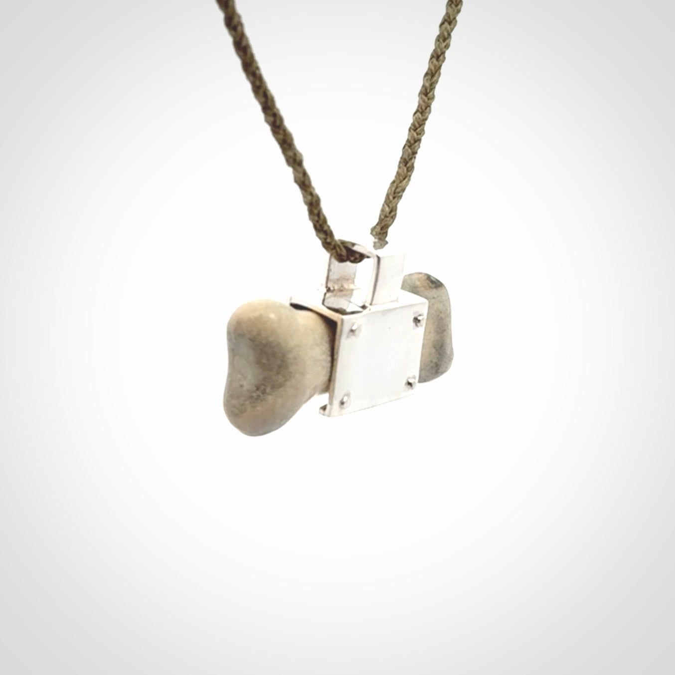 This is a hand carved deer antler dog bone dog tag. It is made from deer antler, bone and sterling silver. Hand made dog tags for your dog.