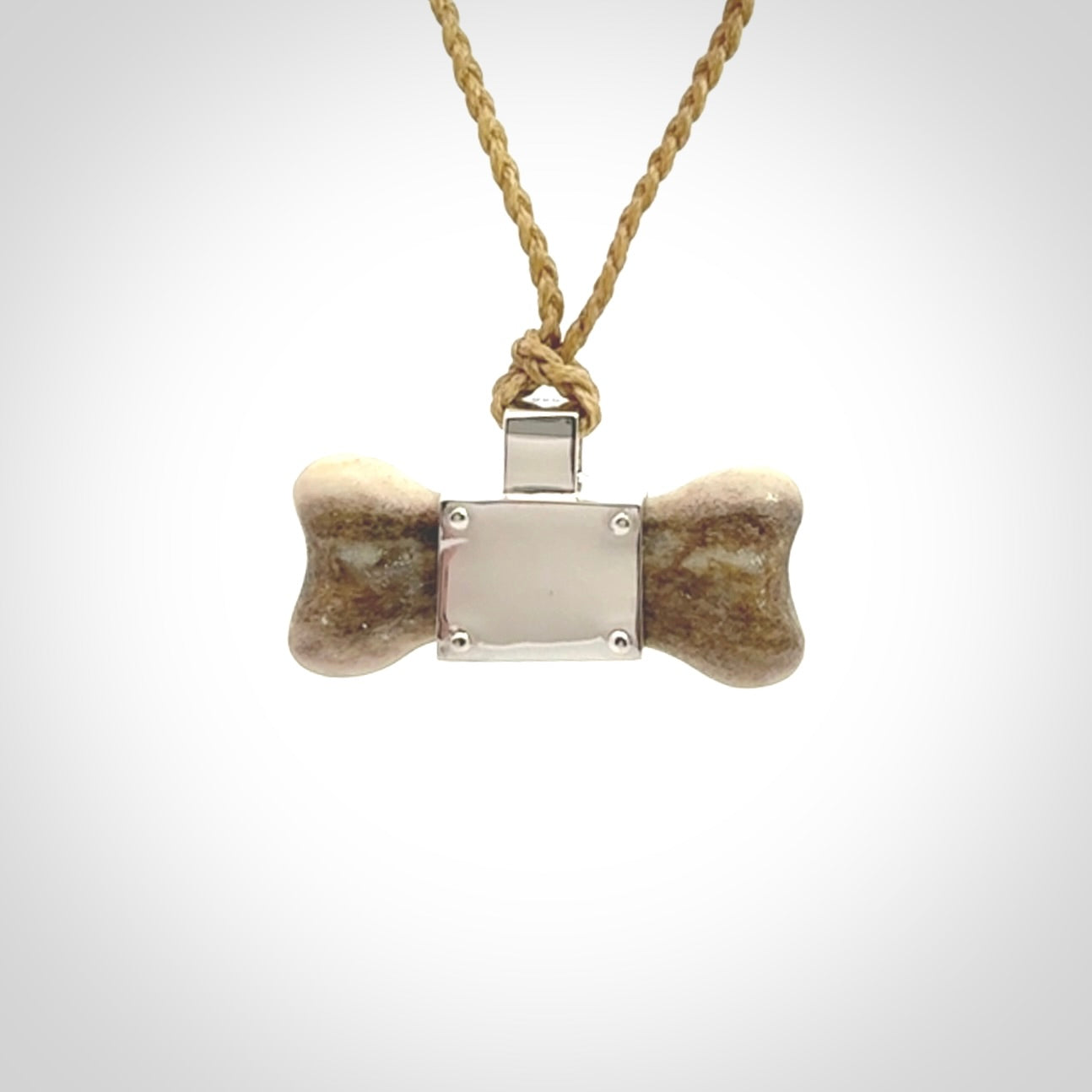 This is a hand carved deer antler dog bone dog tag. It is made from deer antler, bone and sterling silver. Hand made dog tags for your dog.