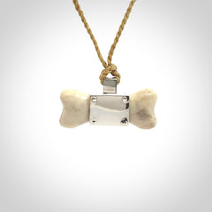 This is a hand carved deer antler dog bone dog tag. It is made from deer antler, bone and sterling silver. Hand made dog tags for your dog.