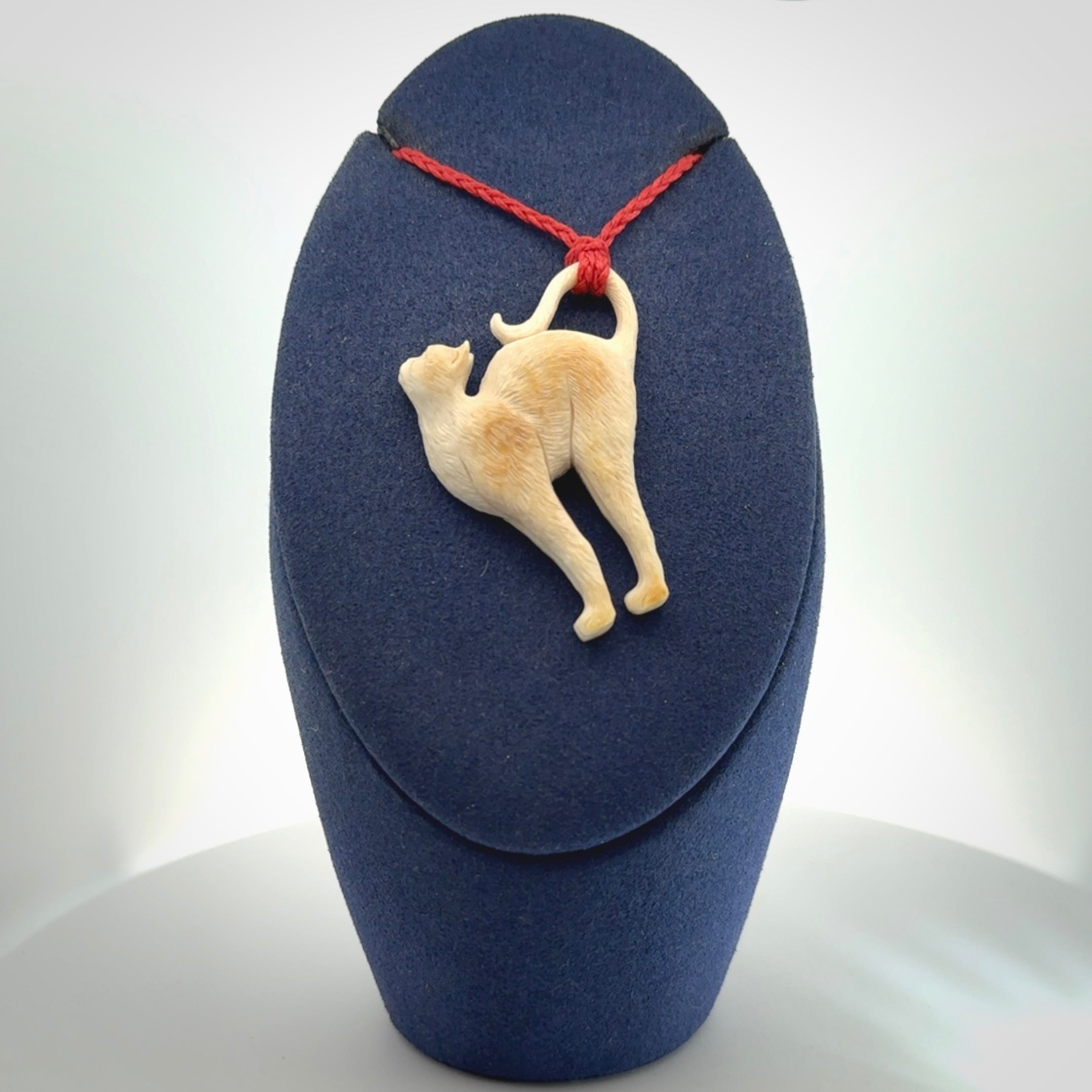 A Charming Stretching Cat Pendant hand made in bone
