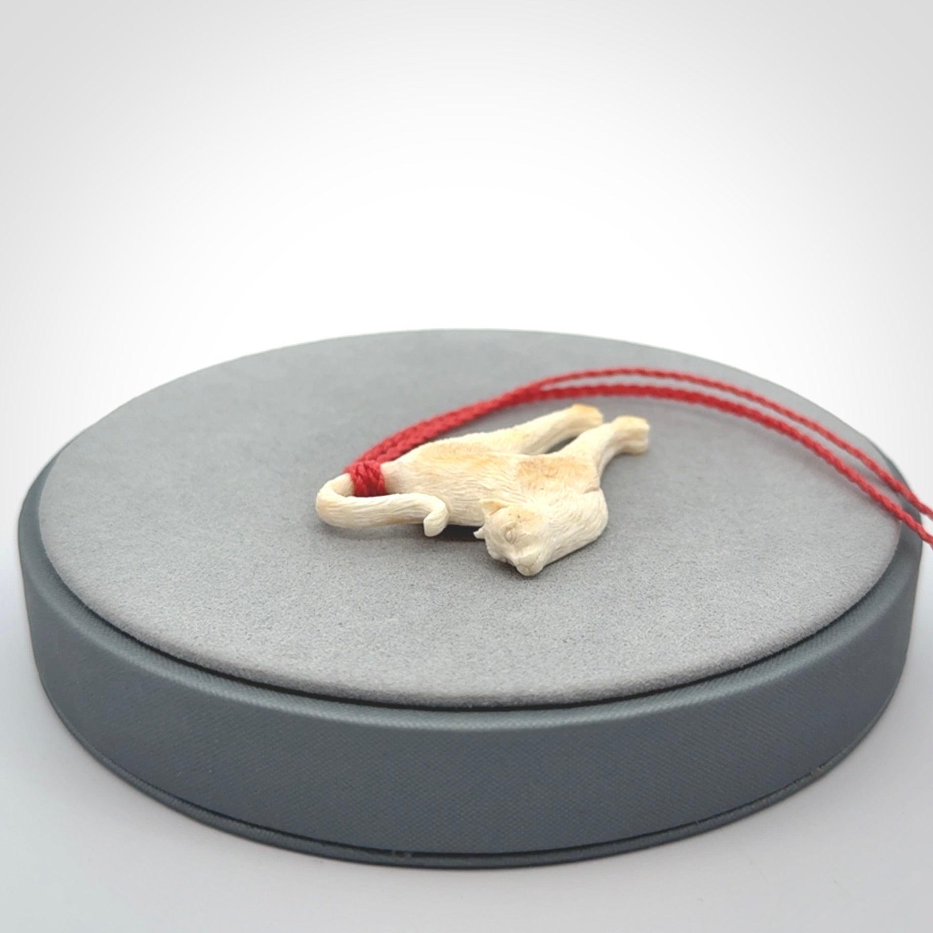 A Charming Stretching Cat Pendant hand made in bone