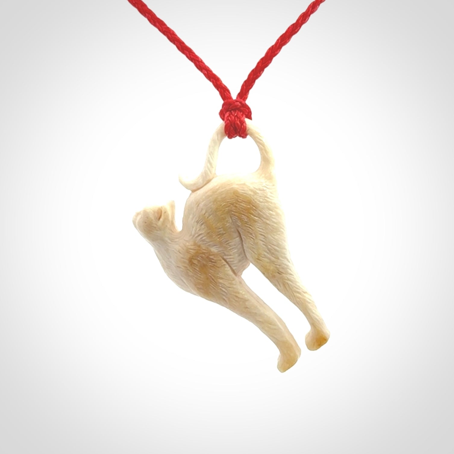 A Charming Stretching Cat Pendant hand made in bone