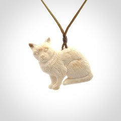 A lovely little cat pendant, hand carved in bone
