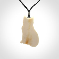 A charismatic cat pendant, hand carved in bone