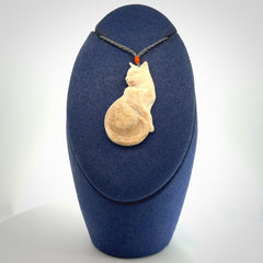 Hand carved bone cat pendant