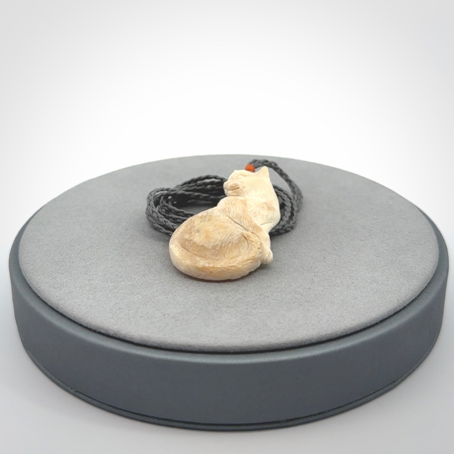 Hand carved bone cat pendant