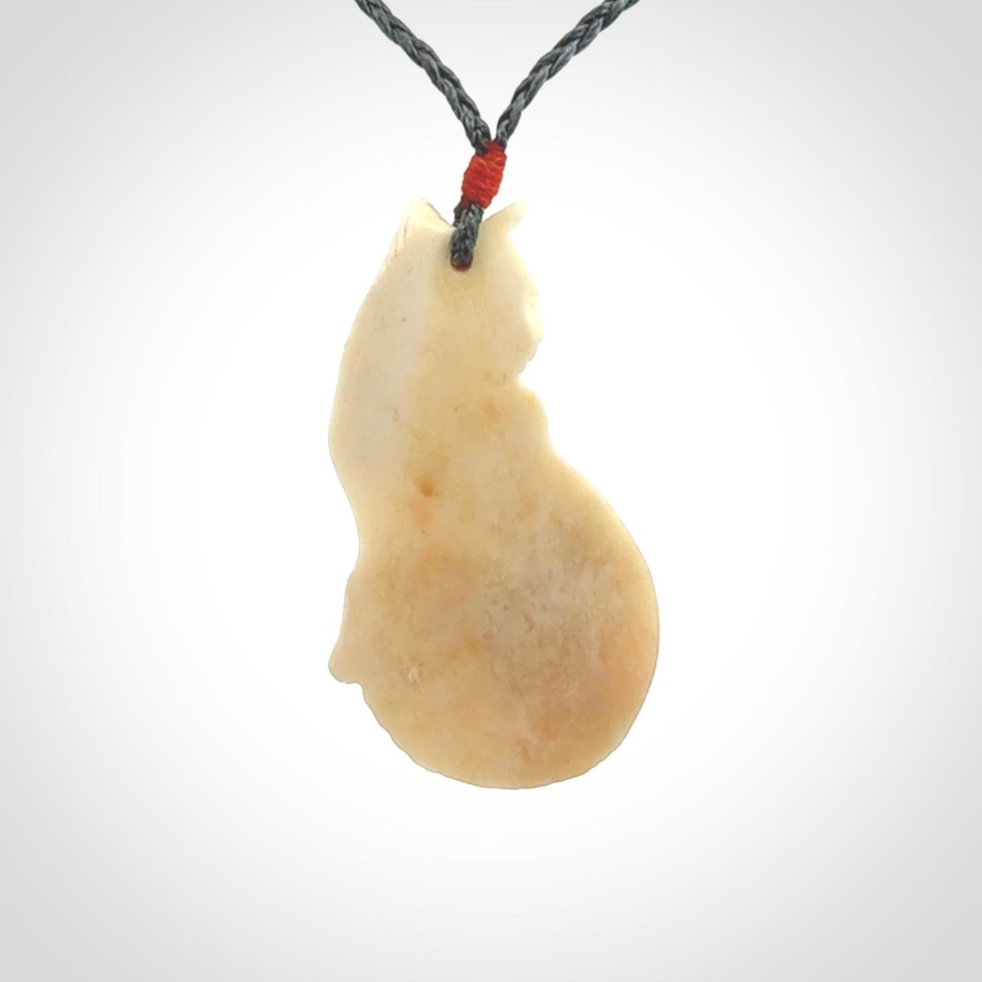 Hand carved bone cat pendant