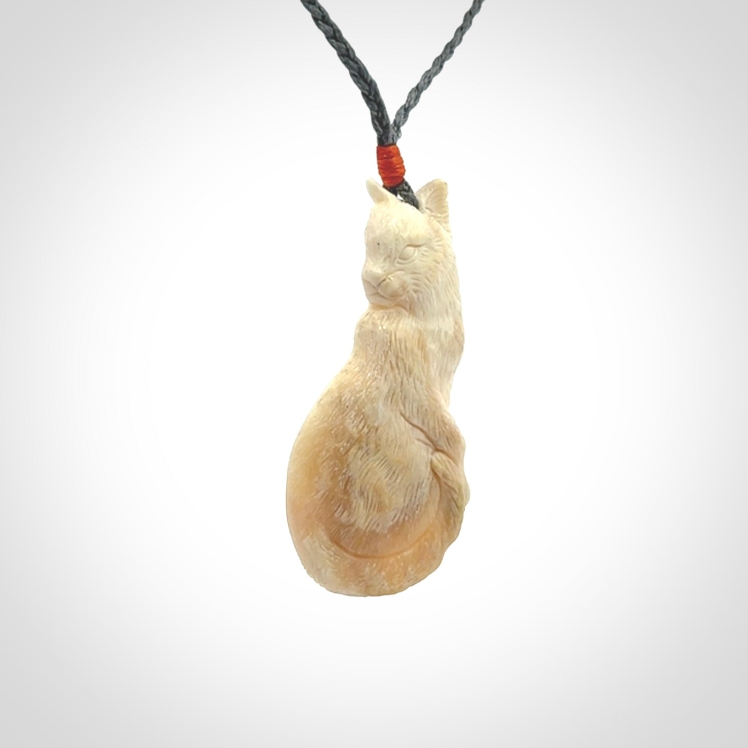 Hand carved bone cat pendant