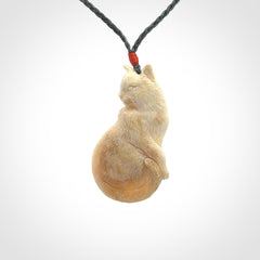 Hand carved bone cat pendant