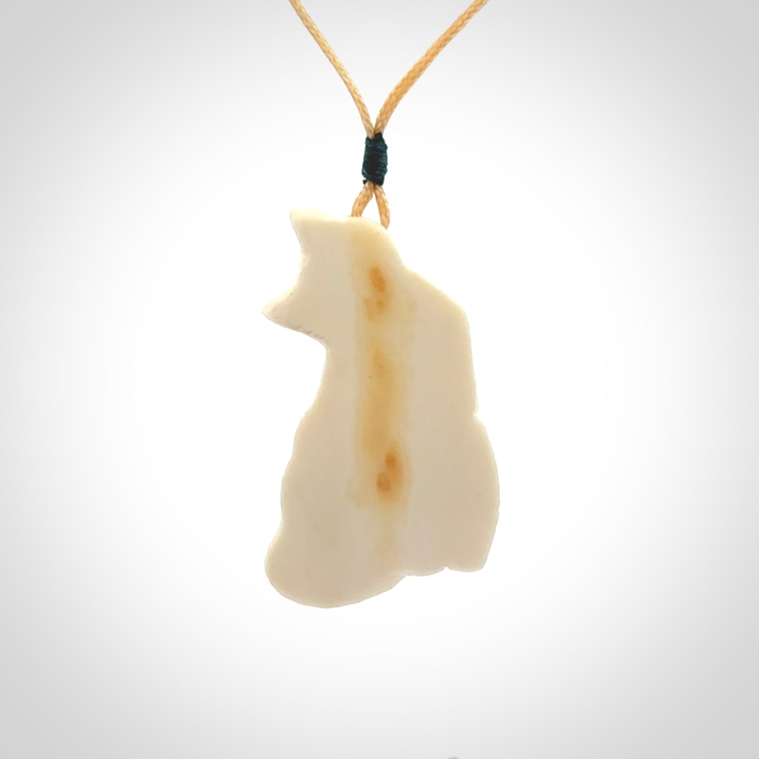 Hand carved bone cat pendant