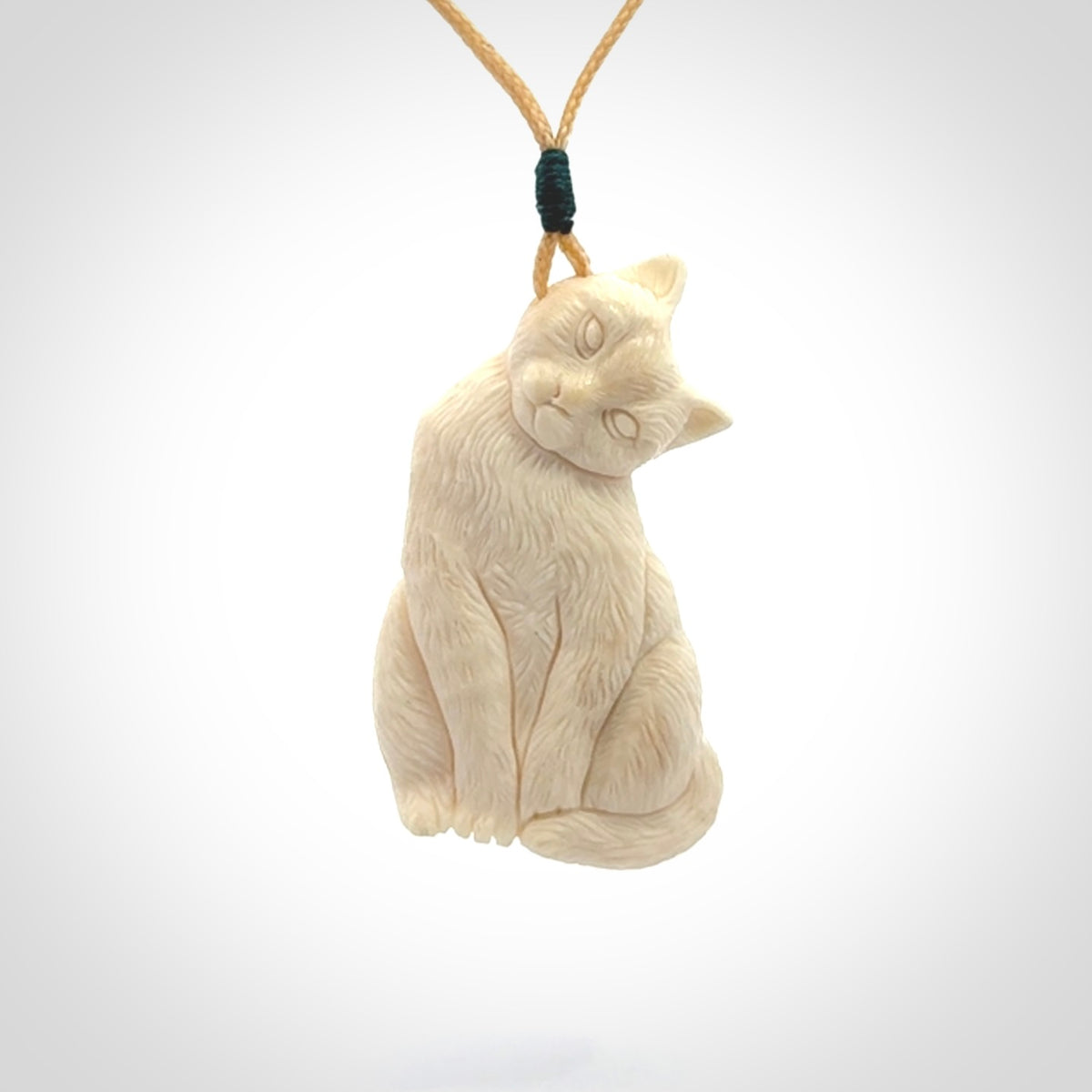 Hand carved bone cat pendant