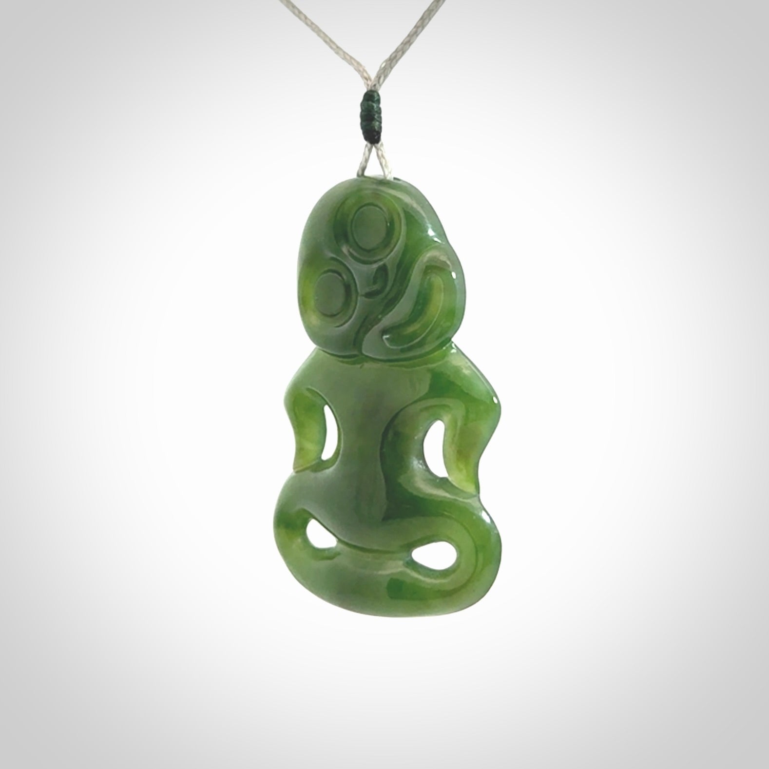This pendant is a large jade tiki pendant. The carving shows wonderful detail on the front while the back is beautifully rounded. These are carved in Columbian Jade. The cord is adjustable in length. Provided in a woven kete pouch and shipped worldwide.