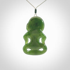 This pendant is a large jade tiki pendant. The carving shows wonderful detail on the front while the back is beautifully rounded. These are carved in Columbian Jade. The cord is adjustable in length. Provided in a woven kete pouch and shipped worldwide.