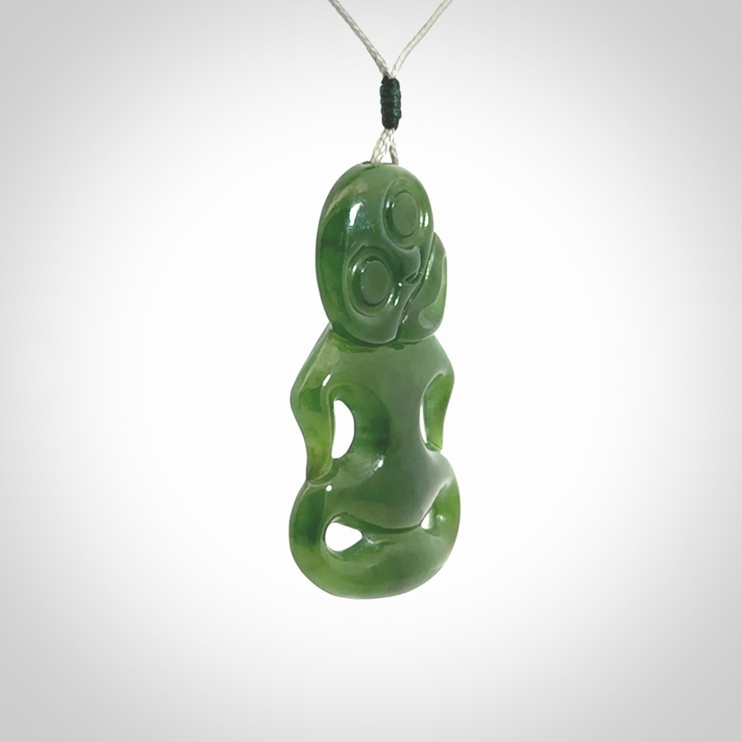 This pendant is a large jade tiki pendant. The carving shows wonderful detail on the front while the back is beautifully rounded. These are carved in Columbian Jade. The cord is adjustable in length. Provided in a woven kete pouch and shipped worldwide.