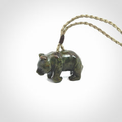 This picture shows a pendant that we designed in New Zealand jade. It is a little green bear that has a walking stance and is carved in detail. A really attractive and eye-catching piece of handmade jewellery. The cord is hand plaited braid and the length can be adjusted.