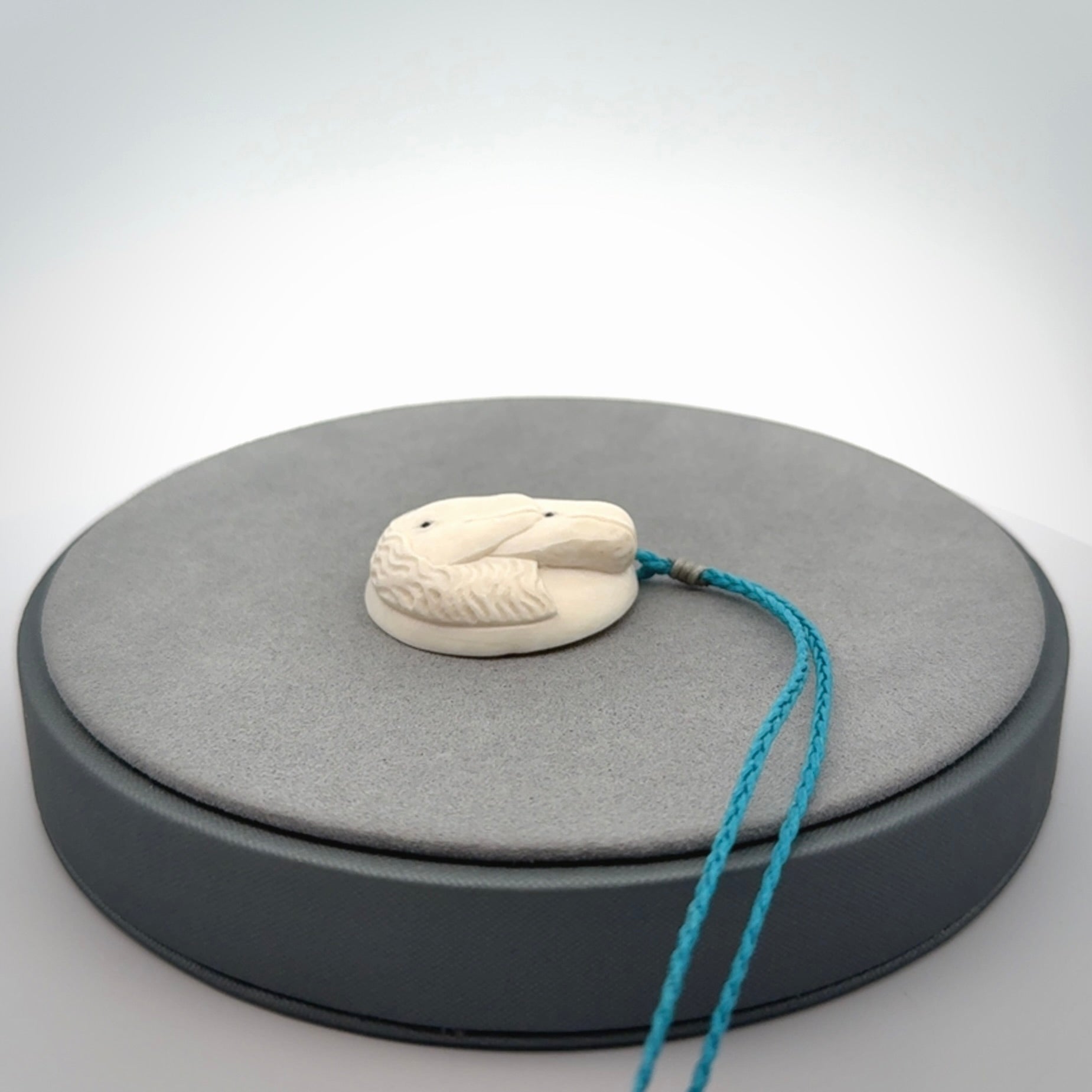 Hand carved woolly mammoth tusk beluga whale pendant