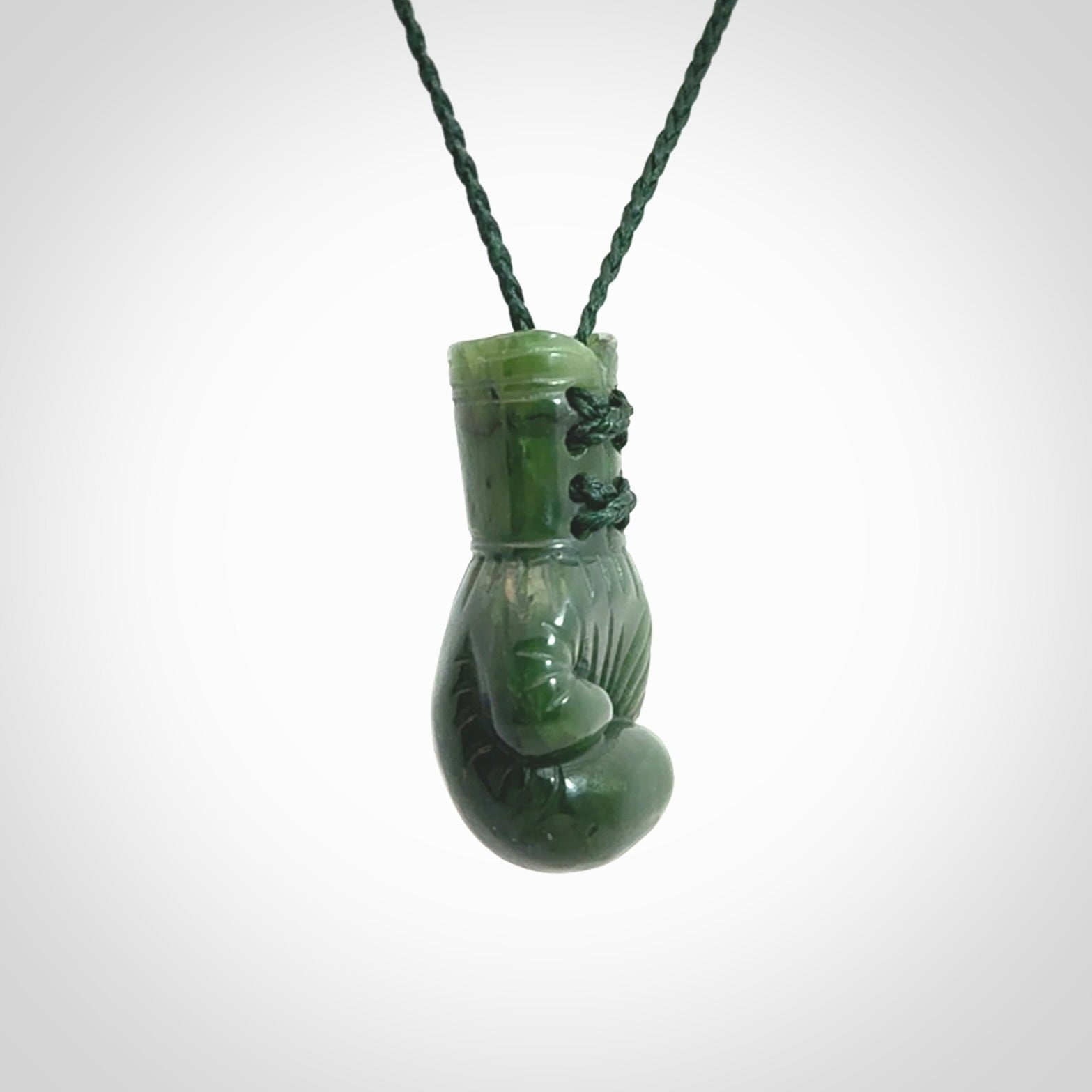 Hand carved boxing glove made from Jade. The cord is adjustable so that you can wear this where it suits you best. The cost of shipping worldwide is included in the price.