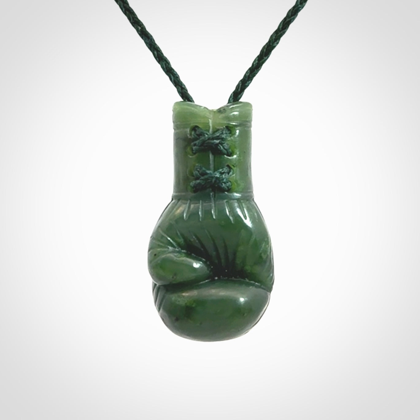 Hand carved boxing glove made from Jade. The cord is adjustable so that you can wear this where it suits you best. The cost of shipping worldwide is included in the price.