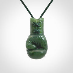 Hand carved boxing glove made from Jade. The cord is adjustable so that you can wear this where it suits you best. The cost of shipping worldwide is included in the price.