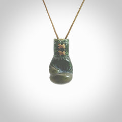 Hand carved boxing glove made from New Zealand Jade. The cord is adjustable so that you can wear this where it suits you best. The cost of shipping worldwide is included in the price.